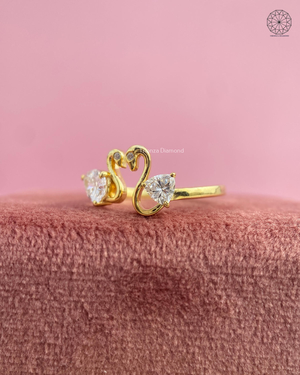 Open front bypass ring crafted in yellow gold with a unique two stone layout