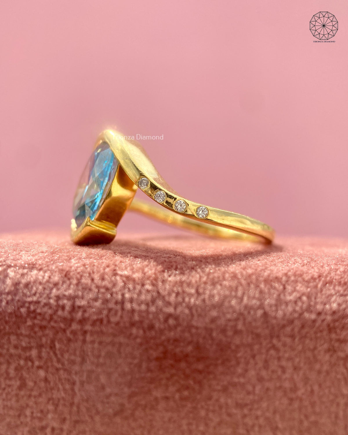 Sculptural swirl wrap engagement ring with flush set lab grown diamond accents around the band