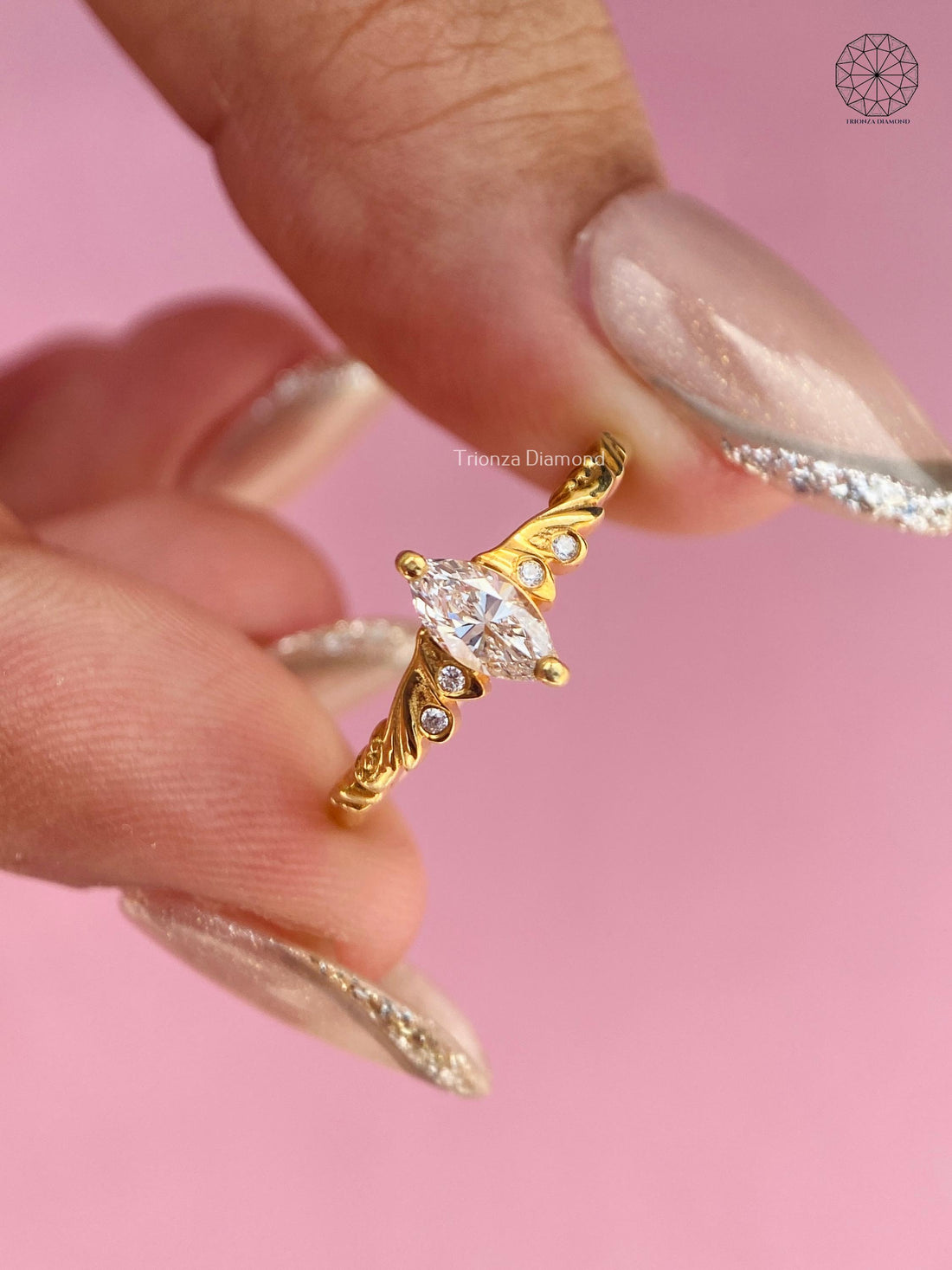 Marquise lab grown diamond engagement ring with yellow gold vintage leaf motif design