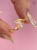 Close-up of the pear cut diamond showing its orange color and excellent polish and symmetry