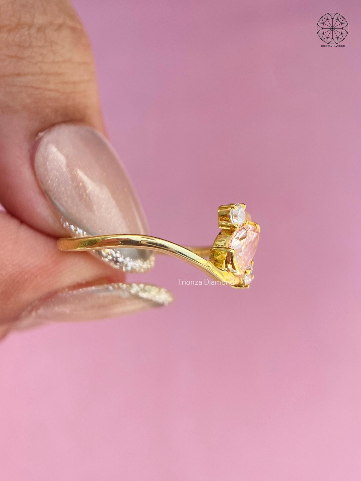 Top view of the three stone ring highlighting the 0.51 CT pear cut diamond measurements