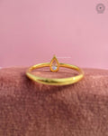 Woman wearing the pear diamond engagement ring, close-up on her hand