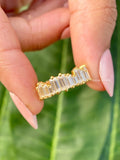 14K gold baguette lab grown diamond eternity ring with a staggered vintage prong setting