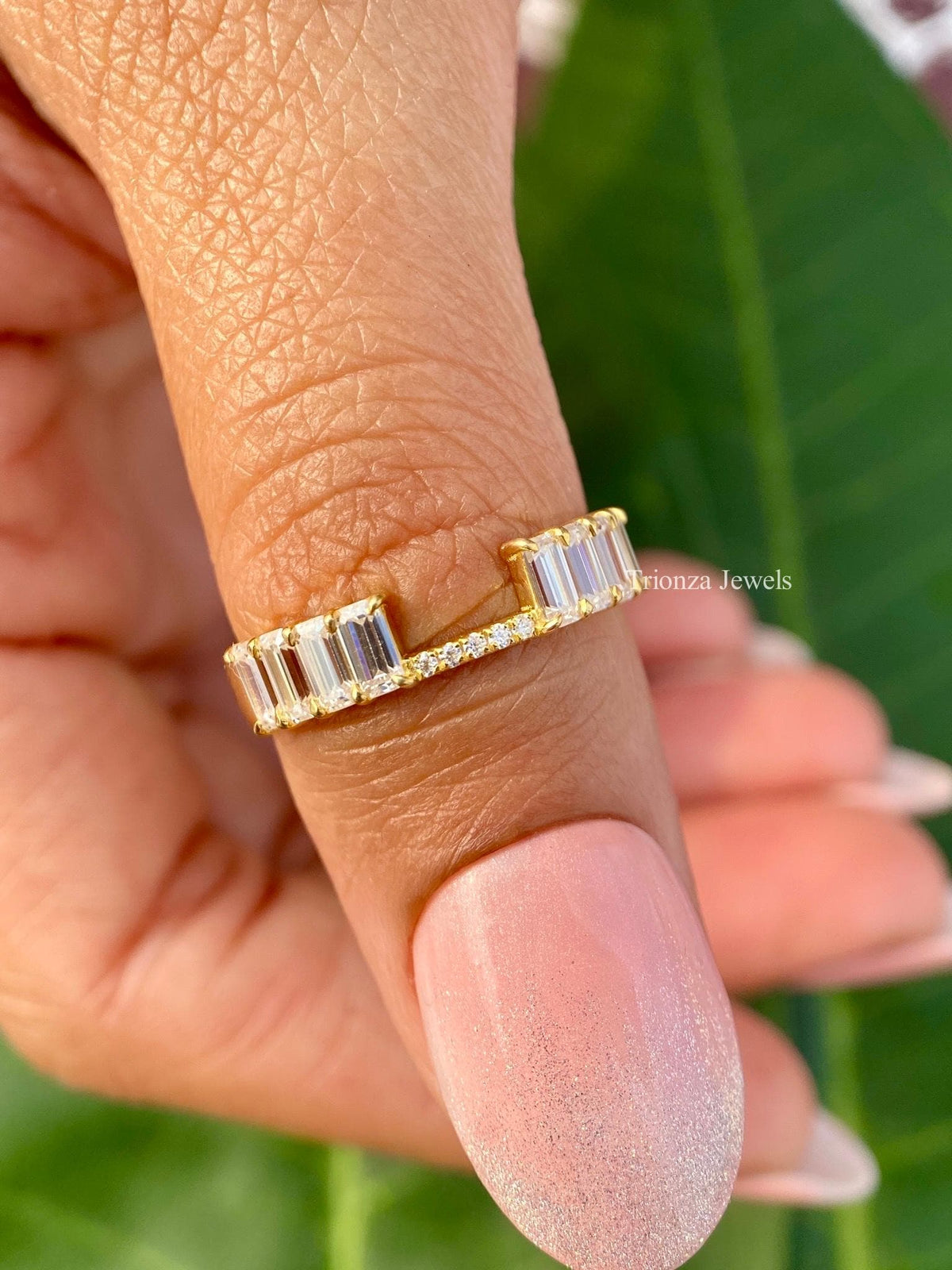 Open wedding band with emerald and round cut lab grown diamonds designed as a stacking ring