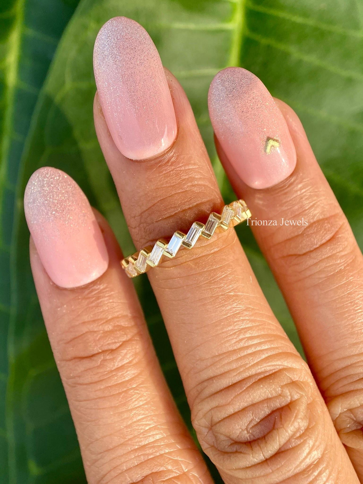 Minimalist baguette diamond ring presented in a jewelry box with smooth fabric
