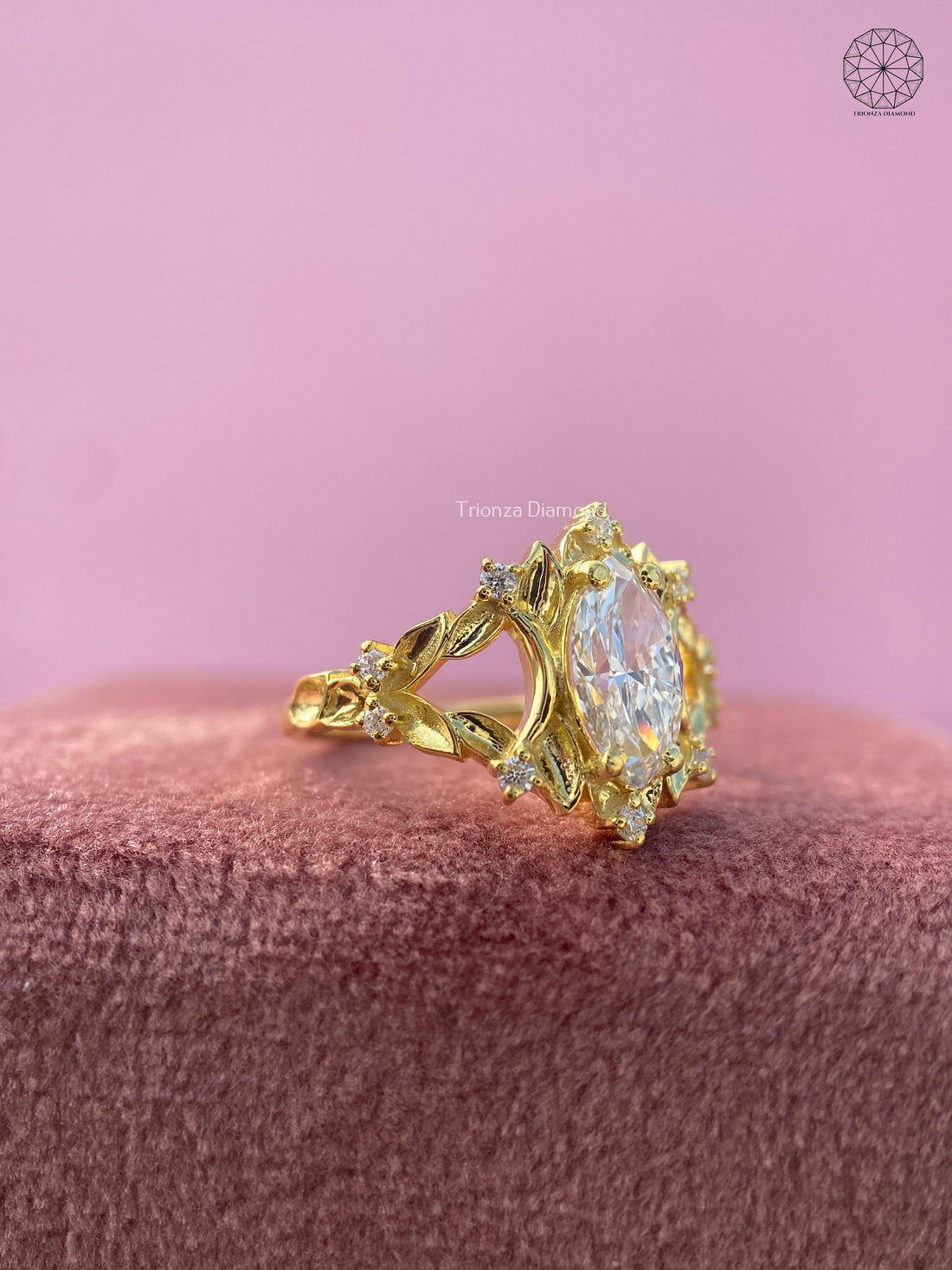 Yellow gold engagement ring featuring a 0.90 CT lab grown diamond in a vintage leaf cluster setting