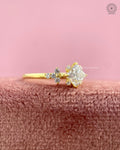 Yellow gold engagement ring featuring a nature inspired flower cluster setting