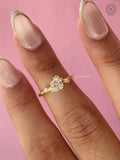 Handcrafted asscher cut diamond ring displayed to highlight its modern cathedral-inspired design