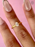 Side profile of the ring highlighting the polished band and prong details