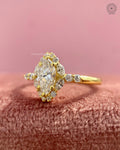 Yellow gold halo ring showcasing round cluster side diamonds for added sparkle