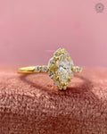 Close-up of the marquise cut center diamond surrounded by a petal halo design