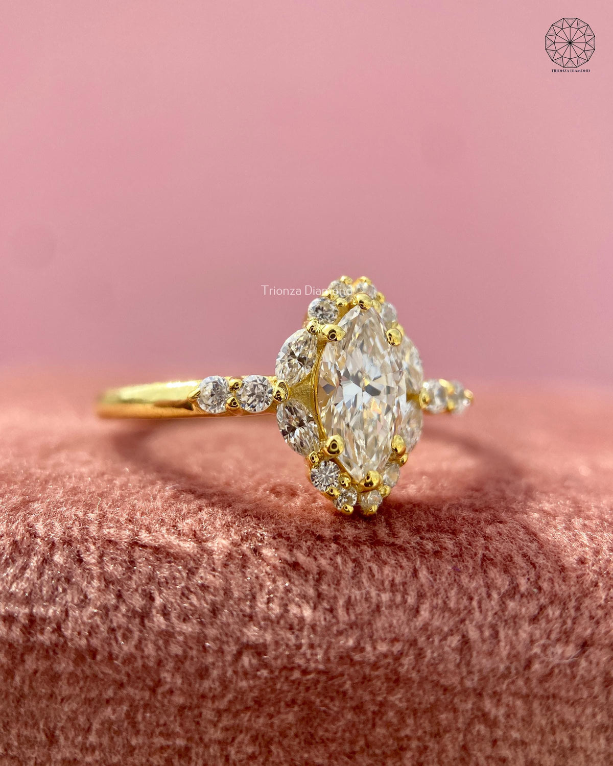 Close-up of the marquise cut center diamond surrounded by a petal halo design