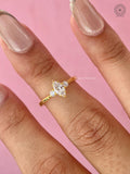 Woman wearing the marquise three stone diamond ring on her hand