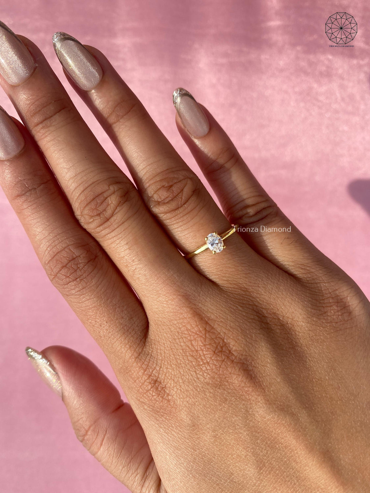 Side view of the oval diamond ring highlighting its vintage promise ring styling