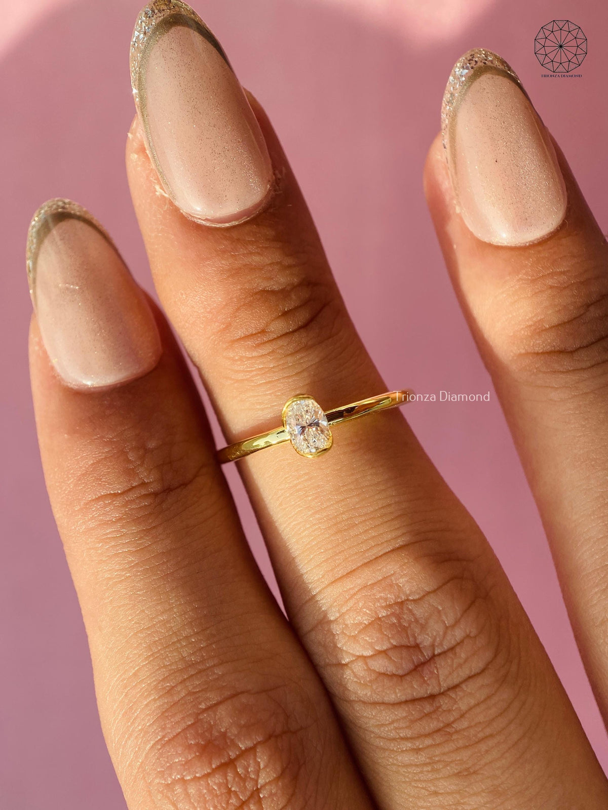 Oval cut lab grown diamond ring displayed to show its minimalist womens design