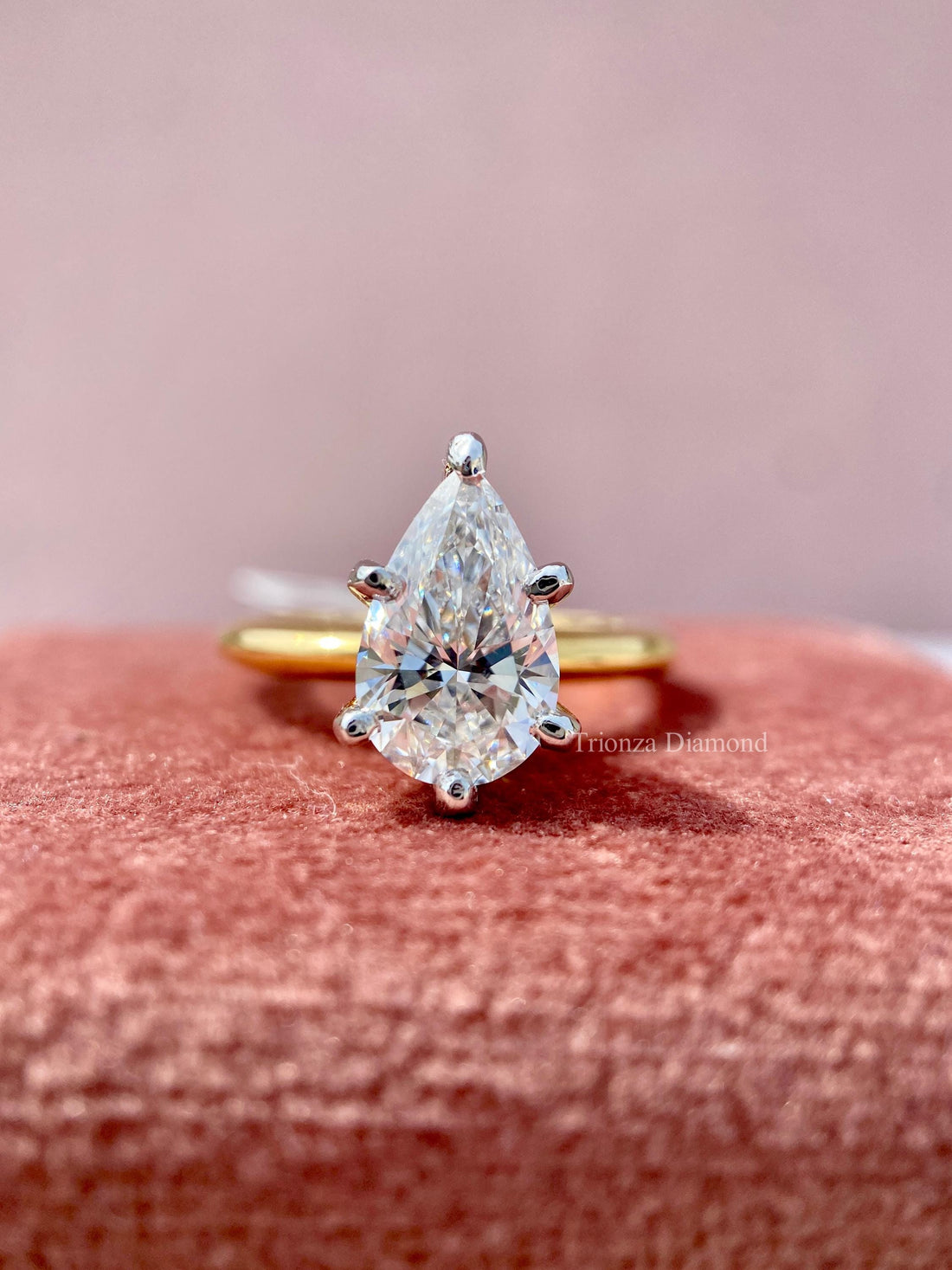 Pear cut lab grown diamond solitaire ring with a two tone six prong setting in 14K gold