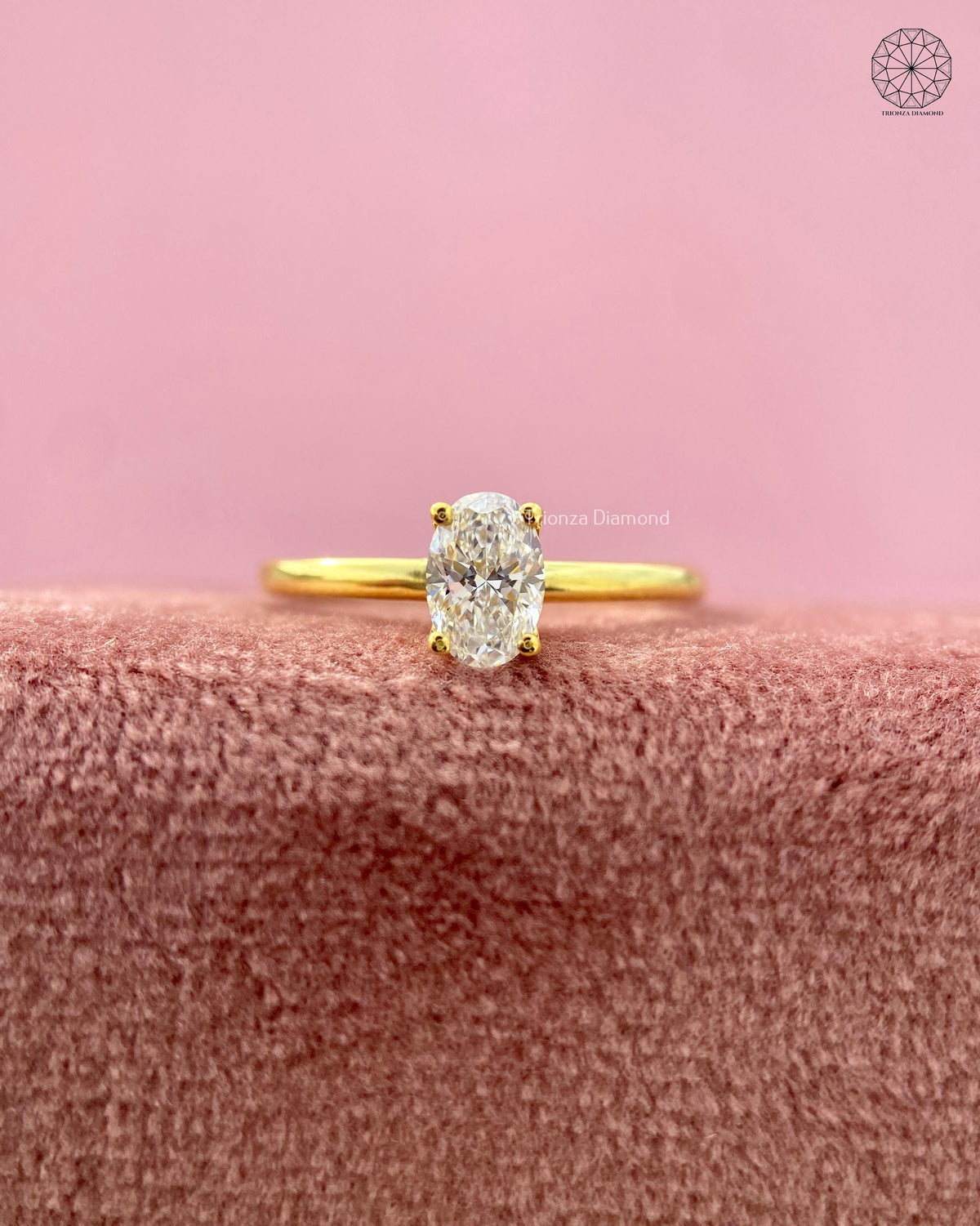 Close-up of the 4 prong setting securely holding the 0.44 CT oval diamond