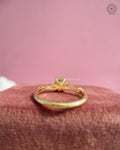 Woman wearing the blue radiant engagement ring, close-up view on her hand