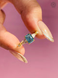 Close-up of the tapered side setting holding the pear cut diamond accents securely