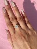 Anniversary ring gift showcasing the oval brilliant cut diamond in a cluster setting