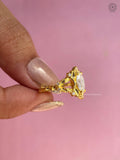 Diamond accent ring displayed in a jewelry box, emphasizing its vintage floral styling