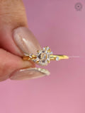 Woman wearing the asscher cut engagement ring with delicate solitaire accents on her hand