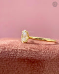 Close-up of the four prong raised head setting securing the oval lab grown diamond