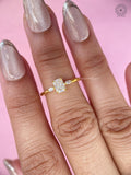 Woman wearing the radiant cut three stone engagement ring on her hand
