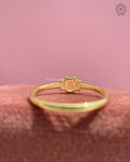 Woman wearing the yellow gold baguette diamond engagement ring for a minimalist bridal look