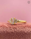 Close-up of the step cut baguette diamonds showcasing the trilogy engagement ring design