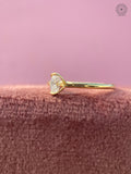Yellow gold solitaire ring showcasing a minimalist plain gold band