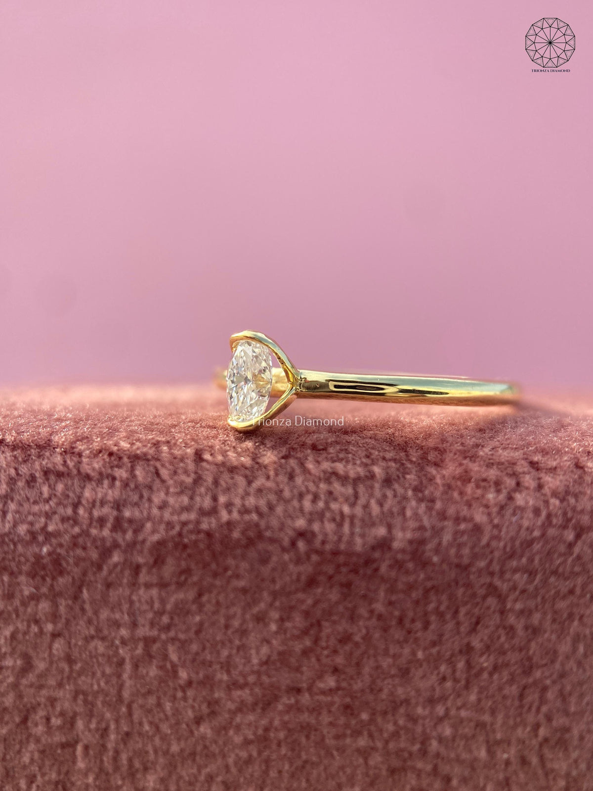 Yellow gold solitaire ring showcasing a minimalist plain gold band