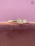 Minimalist solitaire ring featuring an open cuff band design in 18K yellow gold