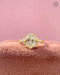 Oval brilliant cut lab grown diamond engagement ring featuring a floral cluster design in yellow gold