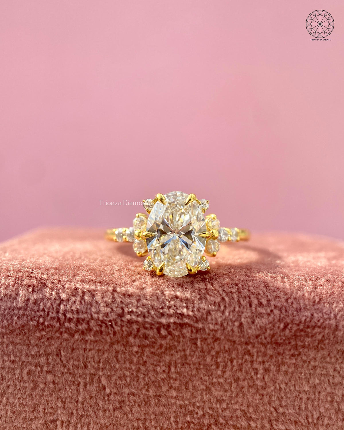 Oval brilliant cut lab grown diamond engagement ring featuring a floral cluster design in yellow gold