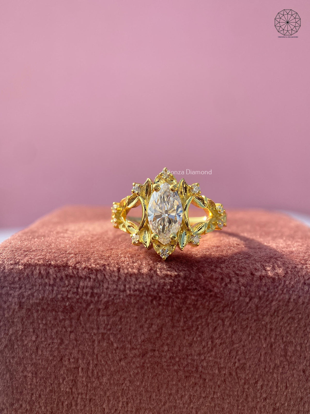 Yellow gold engagement ring featuring a 0.90 CT lab grown diamond in a vintage leaf cluster setting