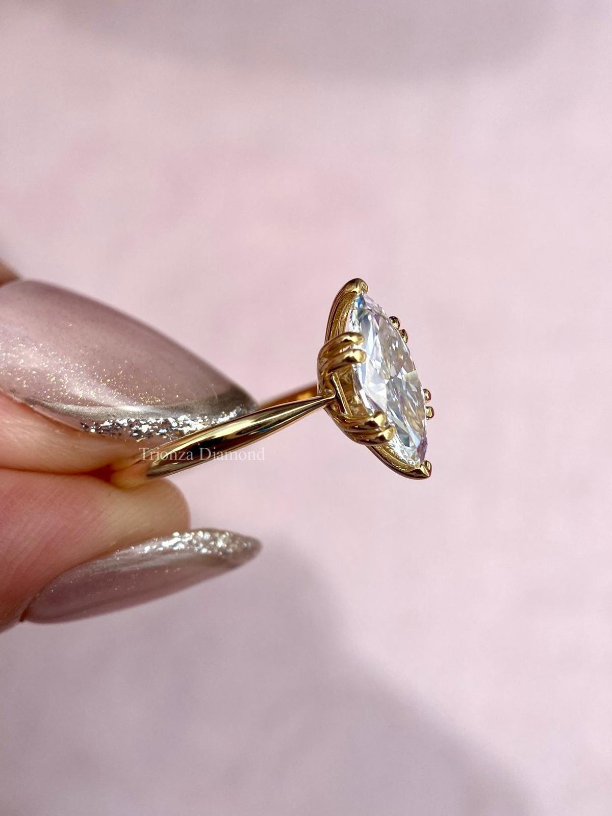 TrionzaDiamond marquise engagement ring handcrafted for a timeless bridal look