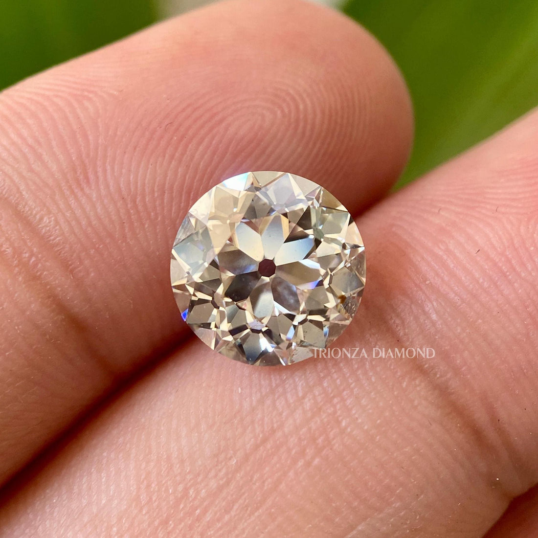 Round old European cut lab grown diamond displayed to highlight its vintage faceting and brilliance