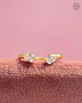 Toi et moi yellow gold ring featuring a pear cut and round brilliant lab grown diamond design