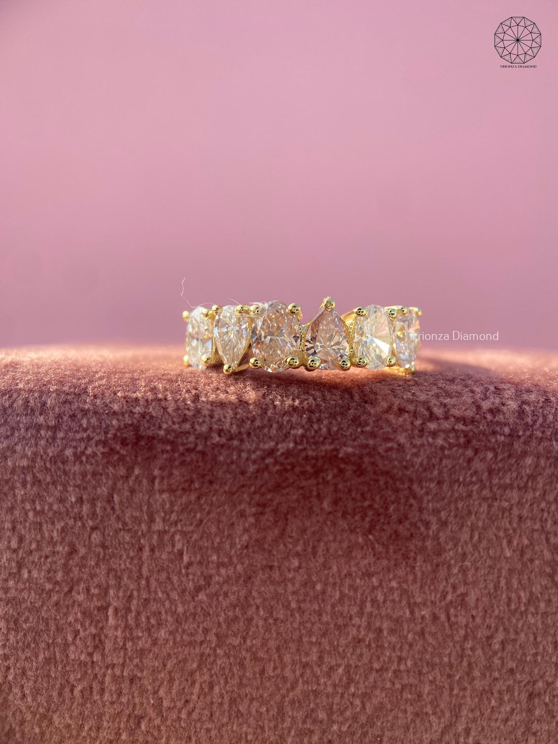 Oval and pear lab grown diamond eternity band with shared prong setting in gold