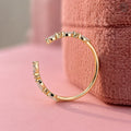 Woman wearing the custom open gap cuff ring for an everyday stackable look