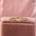 Thin open gap stacking ring featuring a marquise and round cut lab grown diamond design