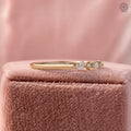Close-up of the shared prong setting holding alternating marquise and round diamonds securely