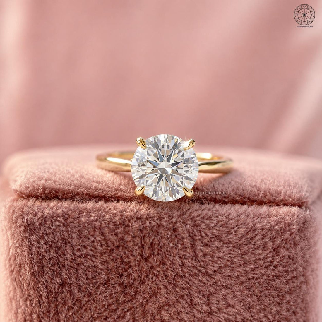 Round lab grown diamond engagement ring displayed in a jewelry box with smooth fabric lining
