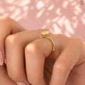 Woman wearing the elongated oval diamond ring styled on her hand for everyday elegance