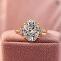 Oval lab grown diamond engagement ring featuring a certified 3 CT center stone in a cluster setting