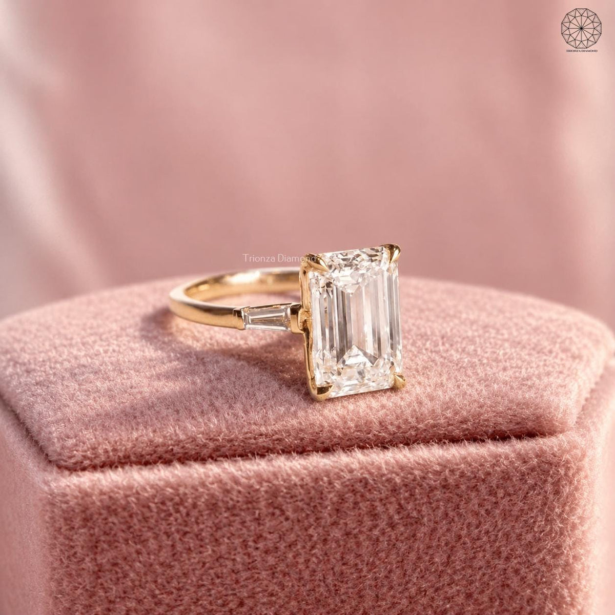 Close-up of the emerald cut center stone paired with baguette cut side diamonds