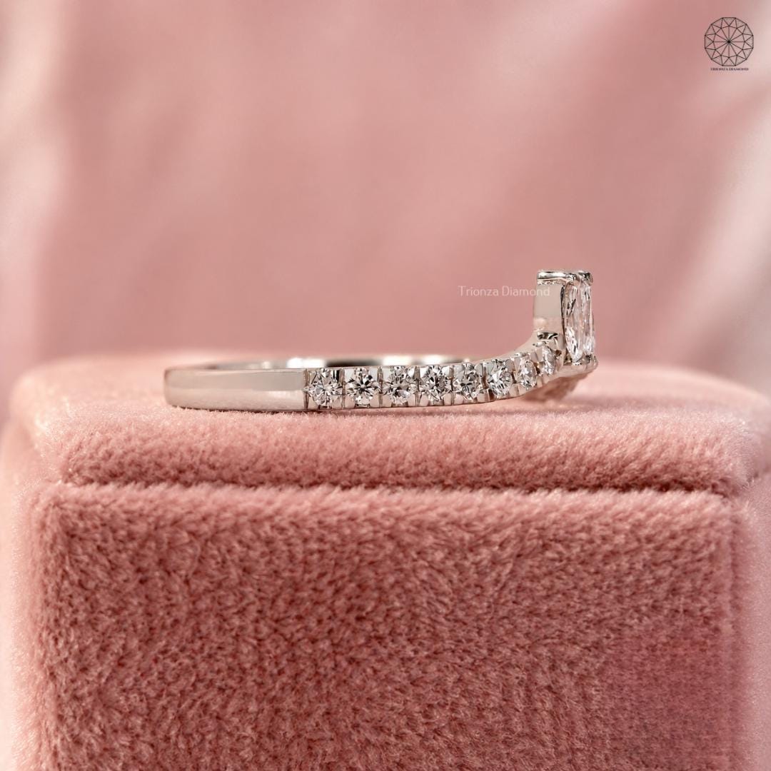 Marquise diamond ring displayed to show the EF color and VVS/VS clarity of the stones