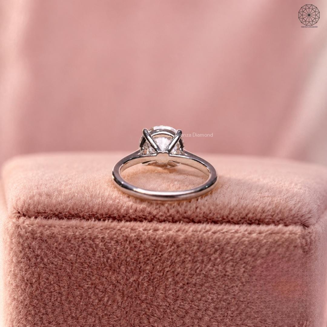 14K and 18K gold solitaire ring featuring a round lab grown diamond centerpiece
