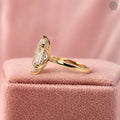 Marquise cut lab grown diamond engagement ring with hidden halo setting in 18K yellow gold
